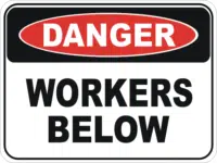 Workers below sign