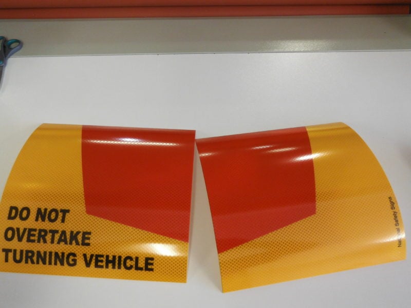do not overtake turning vehicle signs