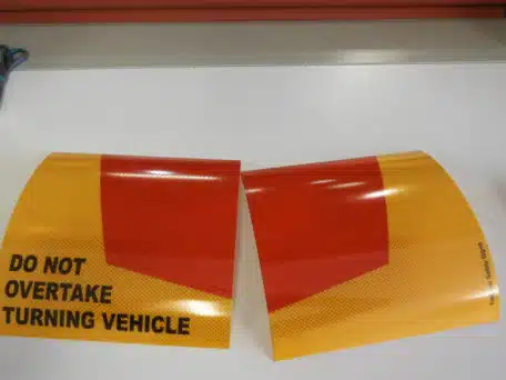 do not overtake turning vehicle signs