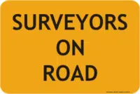 Surveyors on road sign