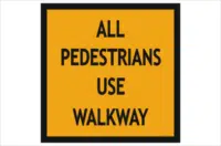 Pedestrians use walkway sign