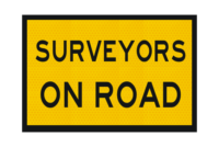 T2-239 Surveyors on Road Sign