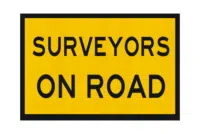 T2-239 Surveyors on Road Sign